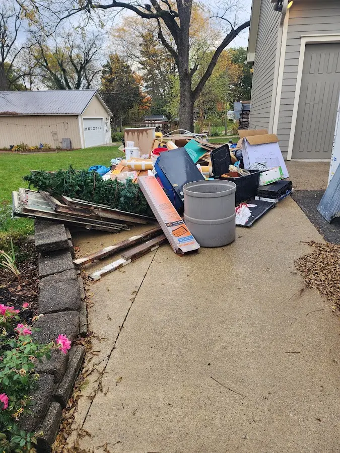 Dumpster being loaded with debris for 30 Yard Dumpster Rental in Springville